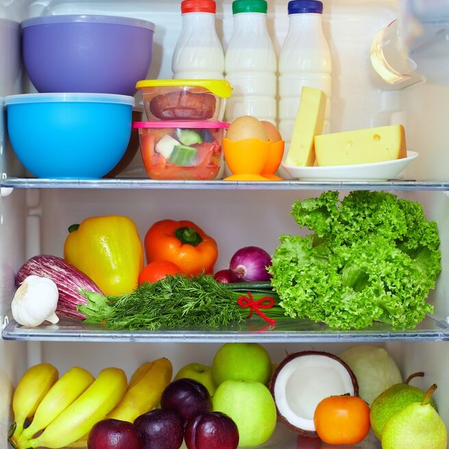 refrigerator full of healthy food. fruits, vegetables and dairy products